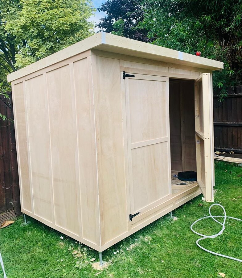 Custom garden shed with built-in planter boxes